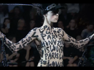 Stephen Sprouse-inspired body grafitti at Marc Jacobs' final LV show. @tmagazine, Twitter.