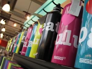 A line of Lululemon water bottles and yoga mats. Lululemon, Flickr.