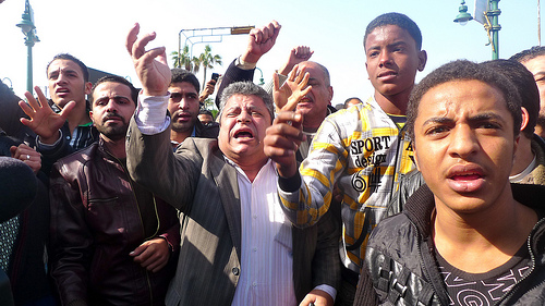 (Protests on the "Day of Departure", Credit Al Jazeera via Creative Commons) (Protests on the "Day of Departure", Credit Al Jazeera via Creative Commons)