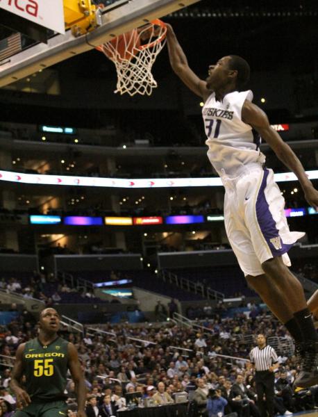 Terrence Ross emphatically slams home a basket against Oregon in the Pac-10 Tournament. (Shotgun Spratling)