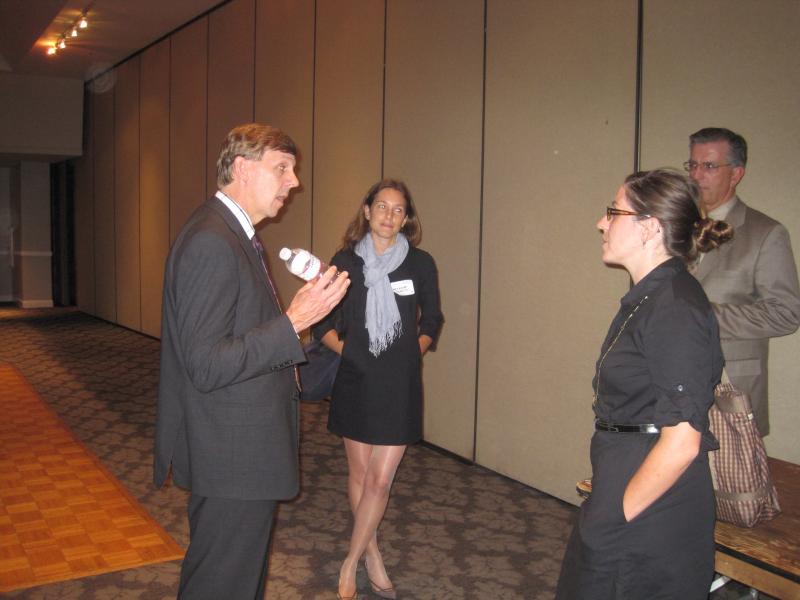 John Dennis, director of Power System Planning and Development, Mike Webster, assistant manager of System Development and Procurement at the DWP discuss future plans with Alexandra Kravetz (far) and Michelle Garakian.