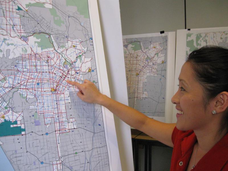 Jane Choi of the Department of City Planning points out new bike routes in the 2010 plan. (Emily Frost)