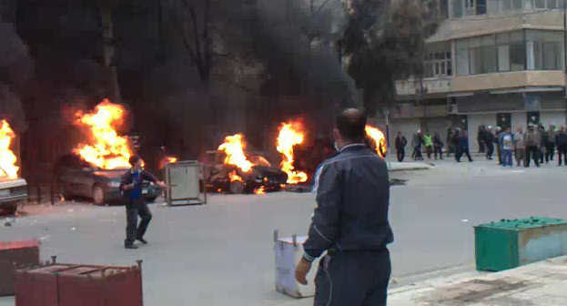 Cars burning in the streets of Danaa, Syria (Photo courtesy YouTube)