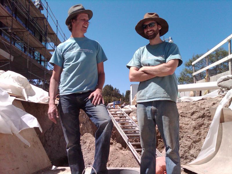 Scott Mathers (left) and Jeff Fuller (right) of Hey! Tanks L.A. take a break from installing an 8,000 gallon rain tank.