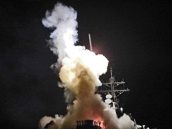 The Arleigh Burke-class guided-missile destroyer USS Barry (DDG 52) launches a Tomahawk missile in support of Operation Odyssey Dawn.