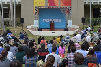 Sandra Cisneros reads at the poetry stage (Ariel Sobel/Neon Tommy)