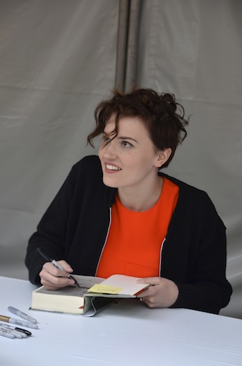 Veronica Roth signs the books of adoring fans after the event (Sara Newman/Neon Tommy)