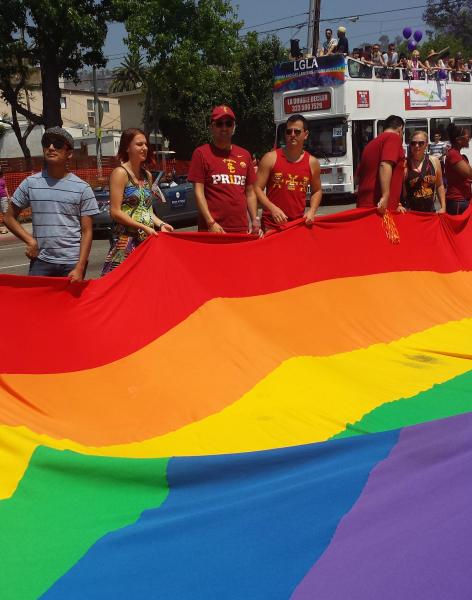 USC students and staff holding the Rainbow flag. (Kristy Plaza/Neon Tommy)