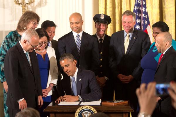 President Obama signing the order for workplace equality for LGBT people. (Twitter/@WhiteHouse)