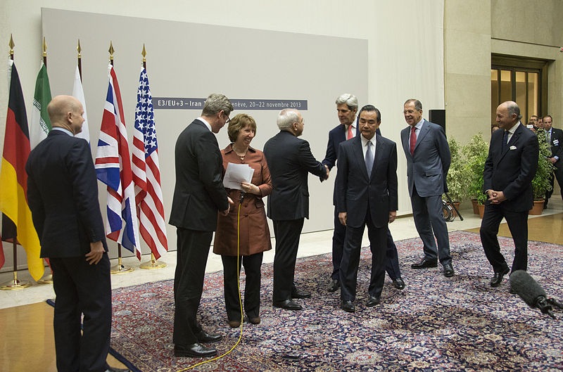 U.S. Secretary of State John Kerry shakes hands with Iranian Foreign Minister Javad Zarif after the conclusion of negotiations about Iran's nuclear capabilities on November 24, 2013. (Wikimedia Commons)