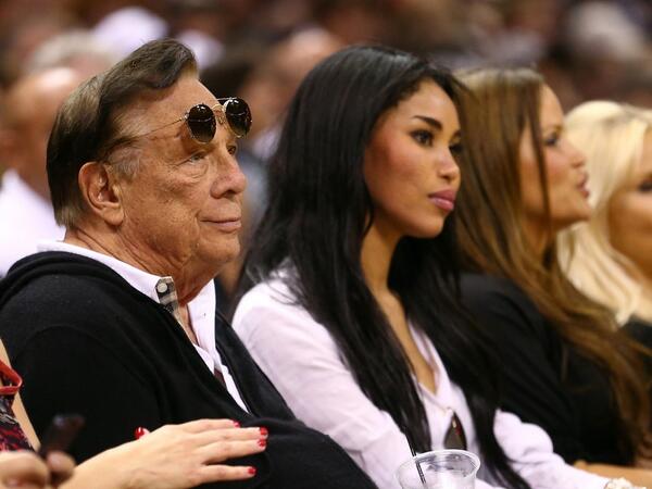 Clippers owner Donald Sterling and his girlfriend, V. Stiviano, sit courtside at a Clippers game. (Twitter/@RTNBA)