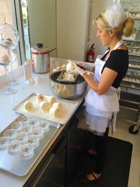 A Mervetty ballerina making coconut flavored Mervettys at the front of the store, which is in Beverly Hills, California. (Margaux Farrell/Neon Tommy)