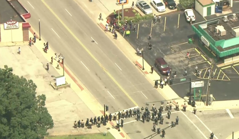 Ferguson police march on protestors after night of civil unrest. (Screencap/KSDK 5)