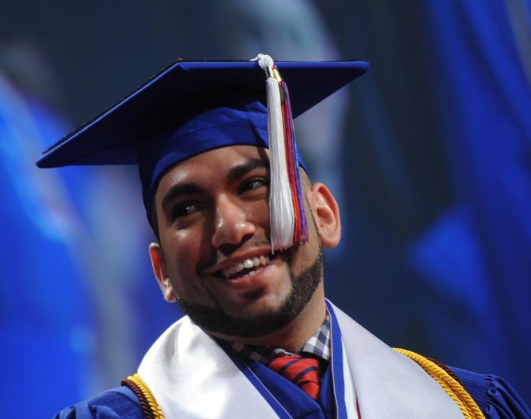 Accepting an honors award at graduation, Photo Courtesy Daniel Alejandro Leon Davis