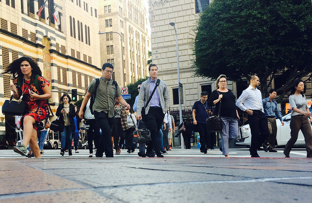 A horde of pedestrians hurry across the 7th Street cross walk. (Emily Mae Czachor/Neon Tommy) A horde of pedestrians hurry across the 7th Street cross walk. (Emily Mae Czachor/Neon Tommy)
