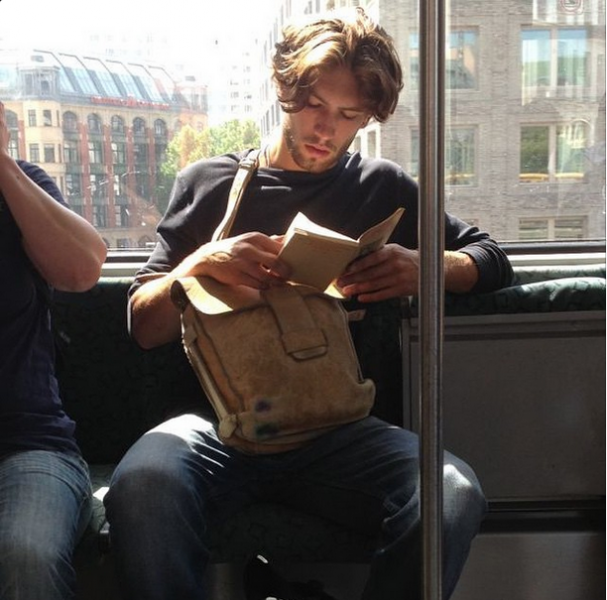 "I'm sure he's reading a collection of post-war Russian short stories, but really thinking of how he made love to his French girlfriend this morning and the gluten free toast they shared after." (Instagram/@HotDudesReading)