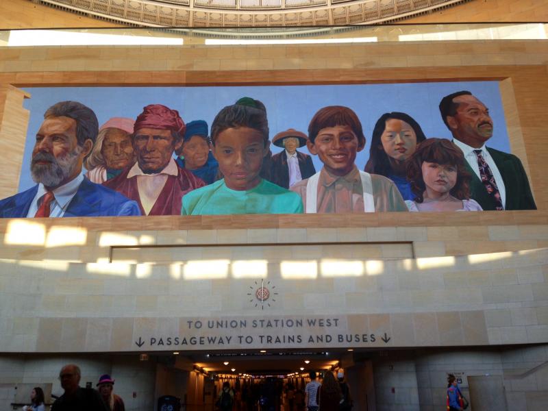 Richard Wyatt's installment of "City of Dreams" hangs over Union Station's eastern entrance. (By Emily Mae Czachor)