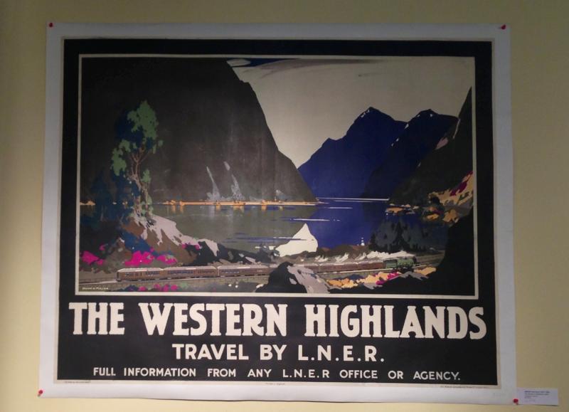 Frank Henry Mason's "The Western Highlands, LNER" juxtaposes the serenity of the Scottish mountains with the urgency of travel. (By Emily Mae Czachor)