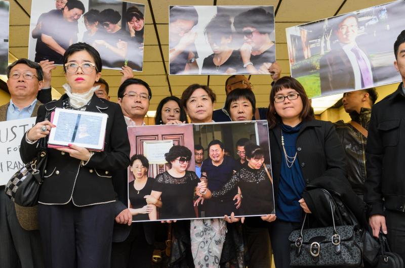 Supporters for Xinran Ji stand with Rose Tsai (second from left), attorney for Ji's family, after the preliminary hearing on 12/12/14 (Benjamin Dunn/Neon Tommy).