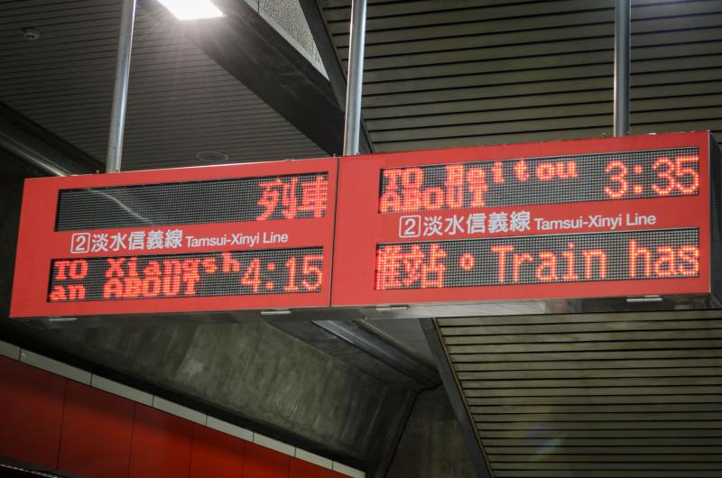 Time tables outside the gates at Shipai station. (Benjamin Dunn/Neon Tommy)