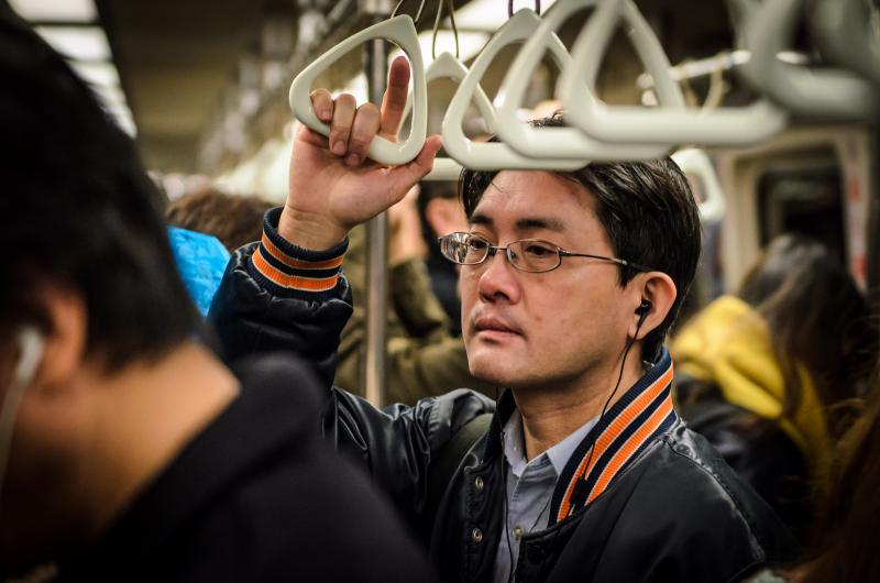 A man waits on the Taipei MRT during New Year's Eve. (Benjamin Dunn/Neon Tommy)