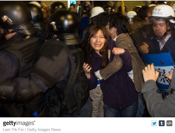  Riot police clash with student protesters outside the Executive Yuan, a branch of government in charge of administrative affairs for all of Taiwan on March 24, 2014 in Taipei, Taiwan. Clashes erupted between protesters and police after Taiwan's president refused to scrap a contentious trade agreement with China and denounced the 'illegal' occupation of parliament by students opposed to its ratification. (Lam Yik Fei/Getty Images)