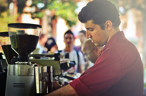 Bobby Roshan worries he'll have to make drastic business changes to keep selling gourmet coffees if the minimum wage hike passes (Amparo Rios)