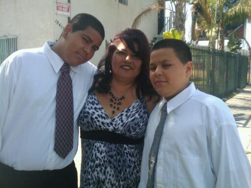 Rosalie Garcia with her sons Andrew and Nicholas near their South L.A. apartment, 2010. Courtesy of Rosalie Garcia.