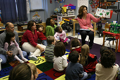 Parents join their children in class for a holiday story. (Woodleywonderworks/Flickr)