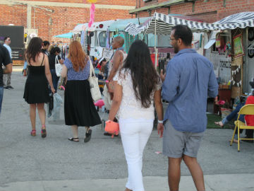 Brokechella guests check out different vendors during the 2014 Brokechella festival. (Celeste Alvarez/Neon Tommy)