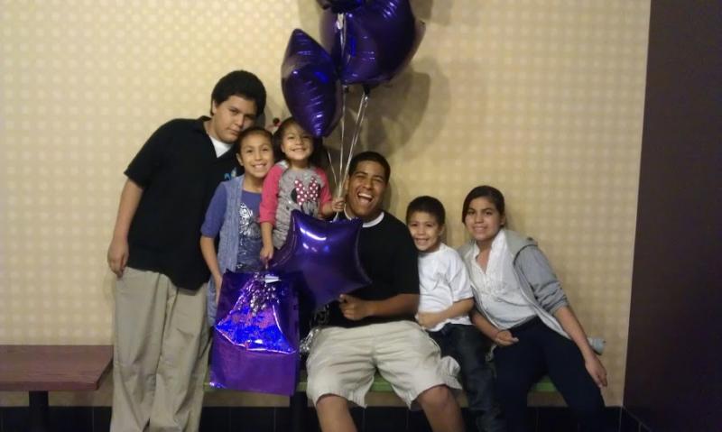 Andrew Garcia (in the center) with his family in happier times. Courtesy of Rosalie Garcia.