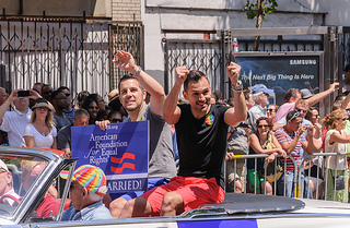 Prop 8 plaintiff’s Paul Katami and Jeff Zarrillo wave during San Francisco’s 2013 Pride Weekend. (Creative Commons/ InSapphoWeTrust )