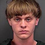  Dylann Storm Roof poses for a mugshot after being arrested by officers. (Photo via WSBTV)