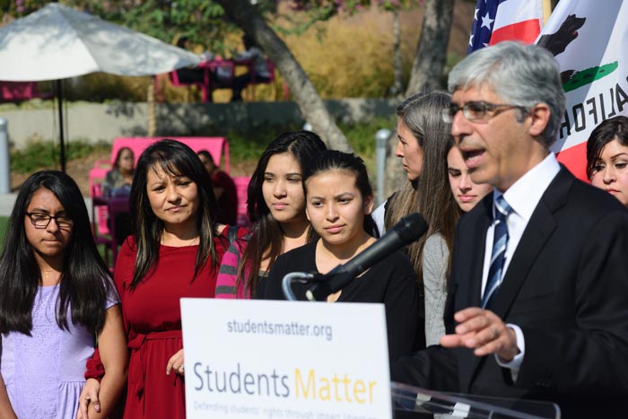 (from left) Julia Macias, Beatriz Vergara, Elizabeth Vergara and Kate Elliot watch with two of their mothers as Ted Boutrous addresses the media Monday. (Charlie Magovern/Neon Tommy) (from left) Julia Macias, Beatriz Vergara, Elizabeth Vergara and Kate Elliot watch with two of their mothers as Ted Boutrous addresses the media Monday. (Charlie Magovern/Neon Tommy)