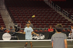 Asher playing tennis. Scarlett Zhiqi Chen / Neon Tommy.