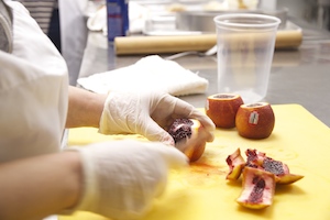 Kellerhals peeling fruit (Zhiqi Scarlett Chen/Neon Tommy).