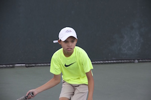 Asher playing Tennis (Scarlett Zhiqi Chen/Neon Tommy)