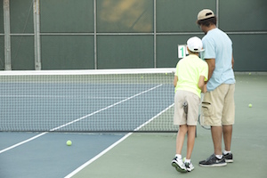 Clarence and Asher play tennis together (Scarlett Zhiqi Chen/Neon Tommy)