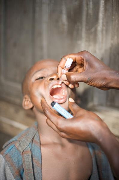 An oral polio vaccine is issued to a child. (Wikimedia Commons)