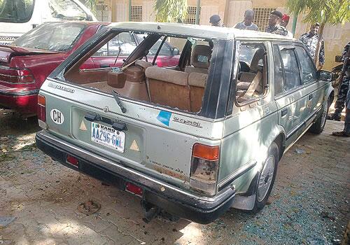 Several cars, such as this one, were damaged by the bombing. (Twitter/@nigeriantribune)