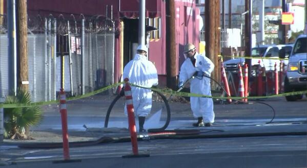 Crews clean up the mess from the oil spill. (@KTLA/Twitter)