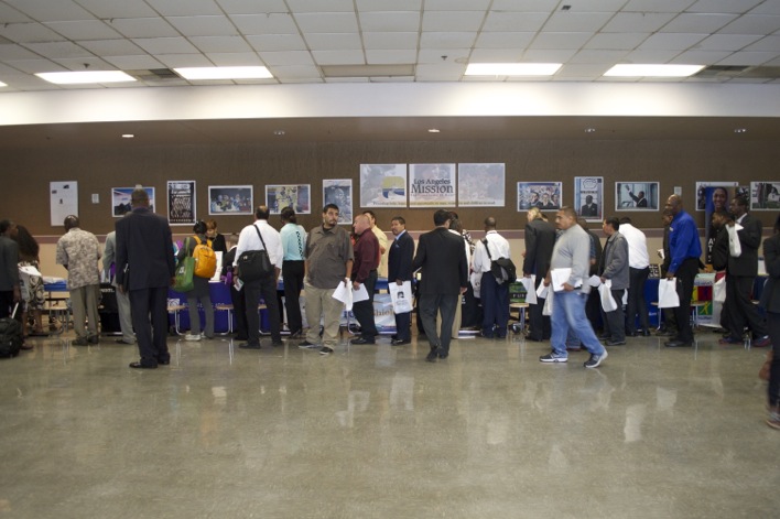 Hopeful job fair attendees line up at employers' tables. (Cassie Paton/Neon Tommy) Hopeful job fair attendees line up at employers' tables. (Cassie Paton/Neon Tommy)
