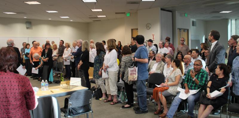 Constituents against the construction of a new 97,800 square-foot shopping center stand to show their opposition at a South Valley Planning Commission meeting Wednesday, March 25, 2015, in a Van Nuys courthouse. (Cameron Quon/neontommy) Constituents against the construction of a new 97,800 square-foot shopping center stand to show their opposition at a South Valley Planning Commission meeting Wednesday, March 25, 2015, in a Van Nuys courthouse. (Cameron Quon/neontommy)