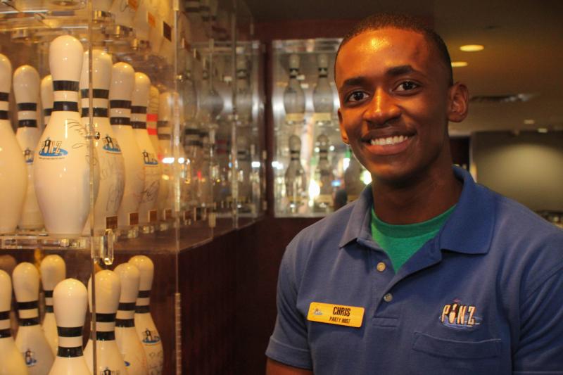 Christopher Williams, 20, a Studio City resident and 4-year employee at Pinz Bowling Alley stands in front of a case of the alley’s many framed pins that have the signatures of big celebrities like Gary Oldman and Kim Kardashian on Friday, May 1, 2015 in Studio City, Calif. (Cameron Quon/neontommy)