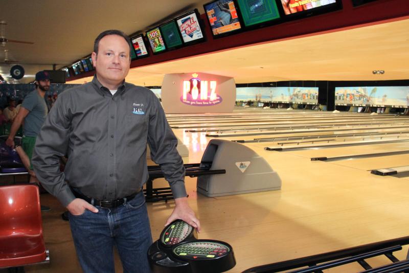 Scott Frager, the general manager of Pinz Bowling Alley stands in front of the lanes that are about to undergo replacement in a near $300,000 rennovation project starting this week on Friday, May 9, 2015 in Studio City, Calif. (Cameron Quon/neontommy)