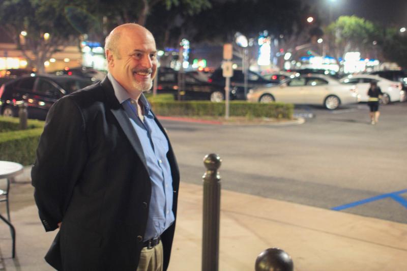 Eric Preven greets constituents outside a supermarket in Studio City. (Cameron Quon/neontommy)