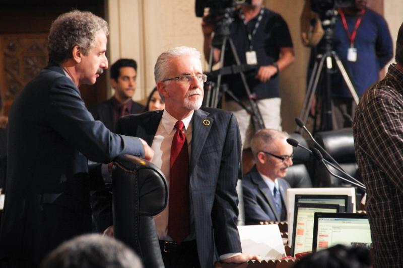 Paul Krekorian (right) is the incumbent for the District 2 councilman seat. He stands with Mike Feuer (left), the Los Angeles City Attorney, during Friday’s city council meeting. (Cameron Quon/neontommy)