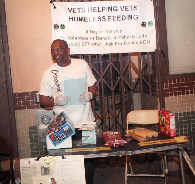 Ron Crockett stands on South Main Street handing out food to the homeless and telling people about homeless veterans. (Cameron Quon/Neon Tommy)