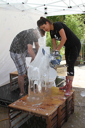 An artist sculpts ice with a chainsaw (Photo by Kaitlyn Mullin) An artist sculpts ice with a chainsaw (Photo by Kaitlyn Mullin)