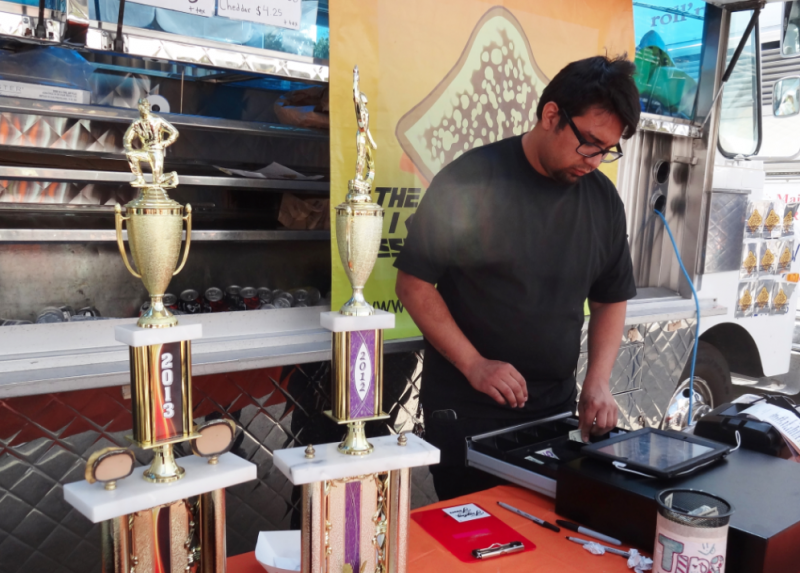 Winners from previous invitationals proudly displayed their trophies in front of their food trucks (Janelle Cabuco/Neon Tommy).